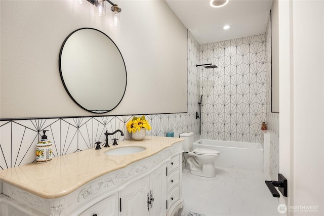 bathroom featuring tile patterned floors, vanity, toilet, and shower / bathtub combination