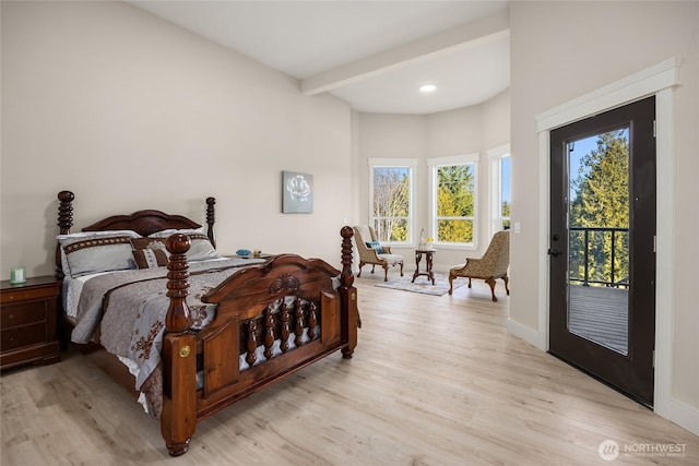 bedroom featuring light wood finished floors, access to outside, baseboards, and beam ceiling