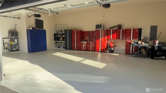 garage with electric panel and strapped water heater