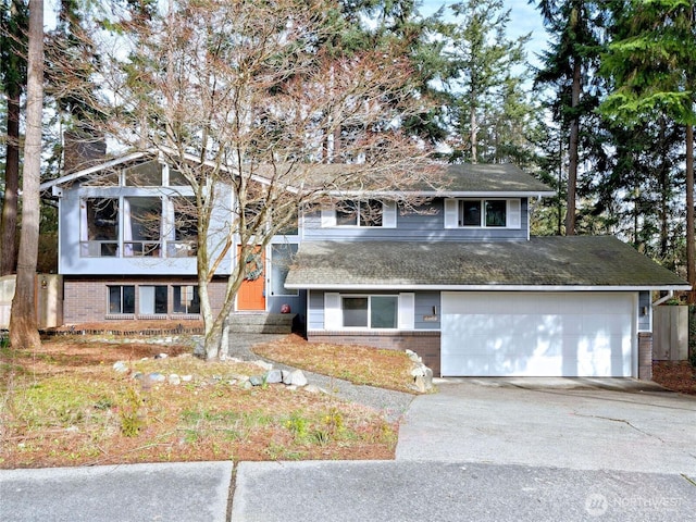 view of front of home with entry steps, an attached garage, brick siding, driveway, and a chimney