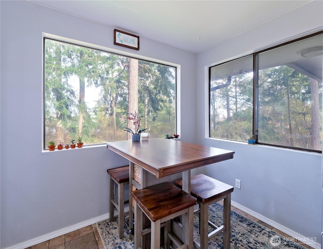 dining area featuring baseboards