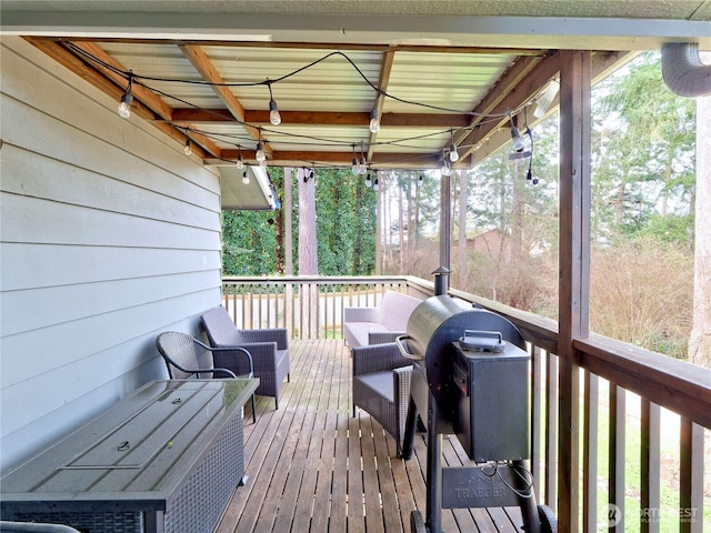 wooden terrace featuring area for grilling