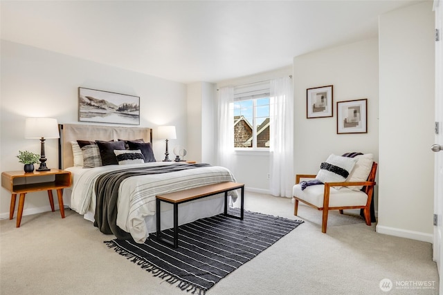 bedroom featuring carpet flooring and baseboards