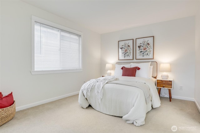 bedroom with carpet floors and baseboards