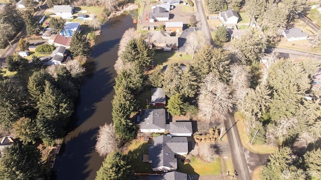 bird's eye view with a water view and a residential view