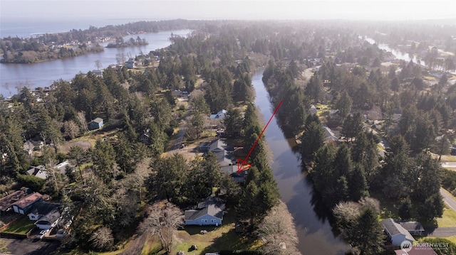 birds eye view of property featuring a water view