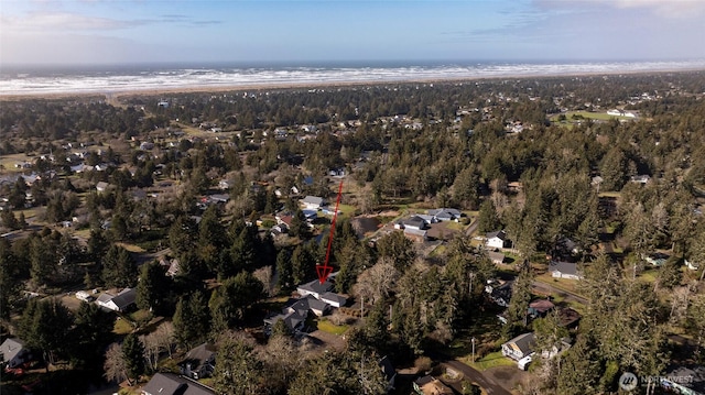 bird's eye view featuring a water view and a view of trees