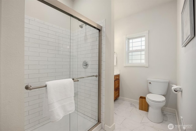 full bath with vanity, baseboards, a stall shower, toilet, and marble finish floor