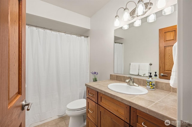 full bath featuring tile patterned floors, toilet, and vanity