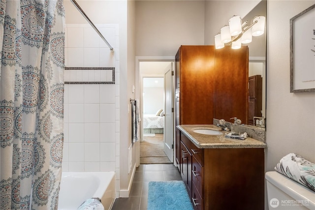 full bathroom featuring toilet, shower / bath combo with shower curtain, vanity, ensuite bath, and tile patterned flooring