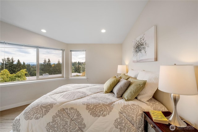 carpeted bedroom featuring recessed lighting, vaulted ceiling, and baseboards