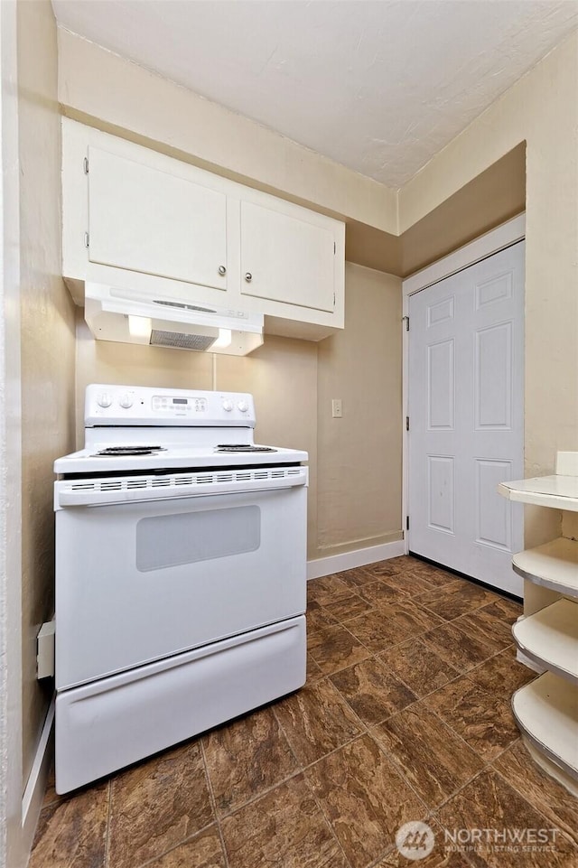 kitchen featuring under cabinet range hood, baseboards, white range with electric stovetop, and white cabinetry