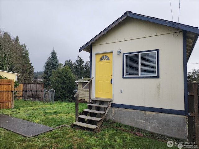 exterior space featuring entry steps and fence