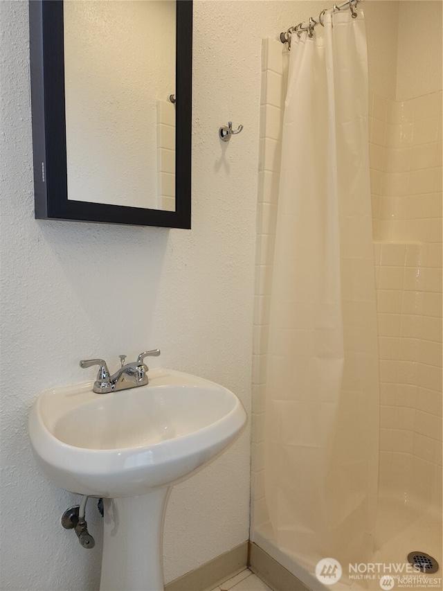 bathroom with a shower stall