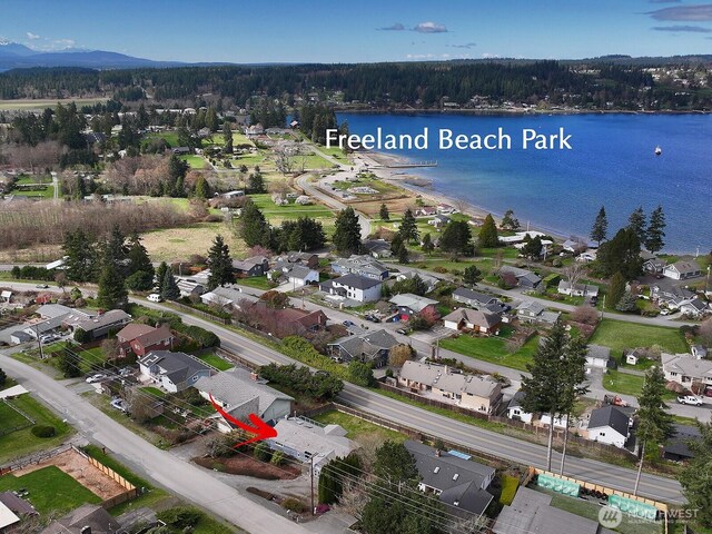 birds eye view of property featuring a water view