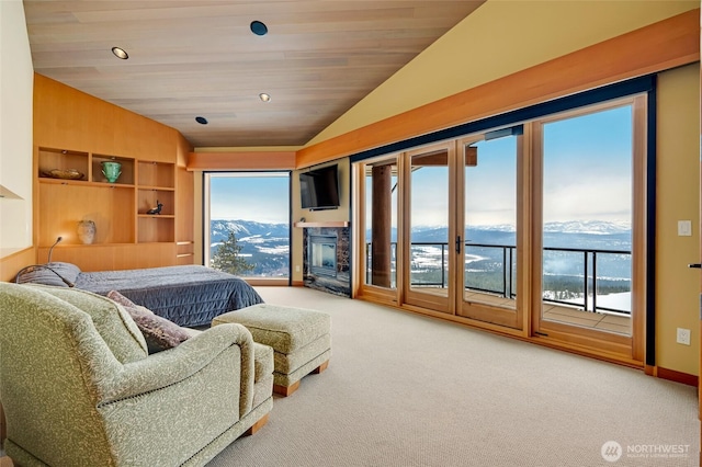 living area with lofted ceiling, carpet, and wood ceiling