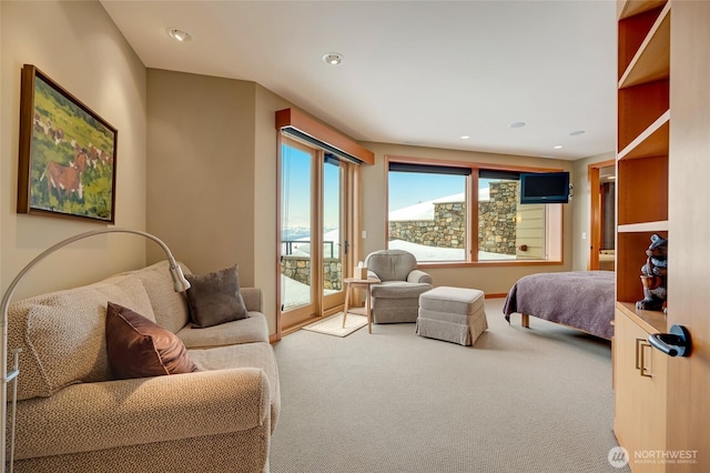 carpeted bedroom featuring access to exterior and recessed lighting