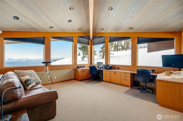 office featuring a wealth of natural light, light colored carpet, built in desk, and recessed lighting