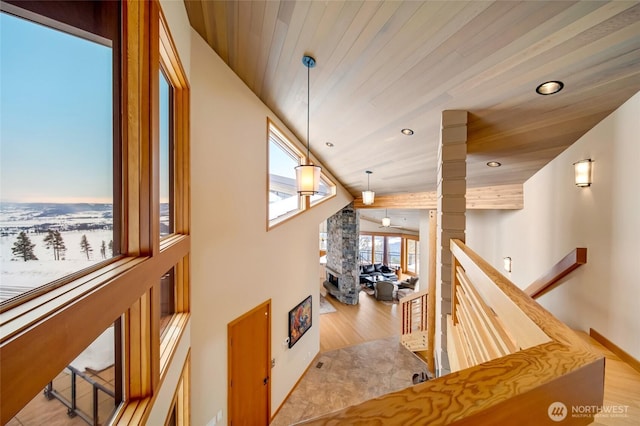 hall featuring recessed lighting, wood finished floors, wood ceiling, an upstairs landing, and vaulted ceiling