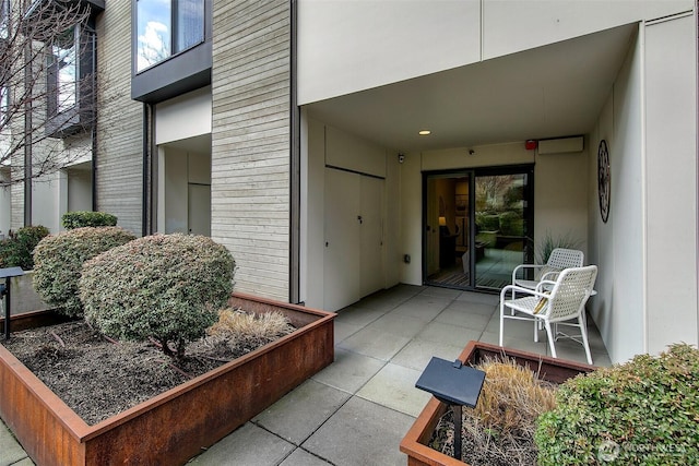 doorway to property featuring a patio area