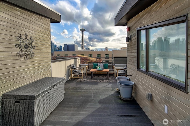 balcony with a view of city and outdoor lounge area