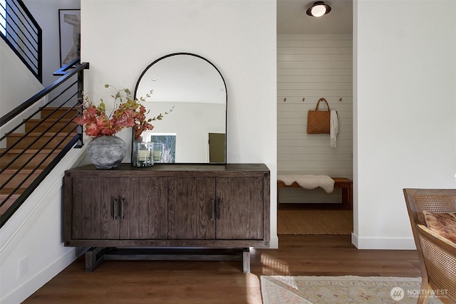 bathroom with baseboards and wood finished floors