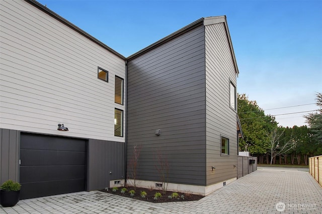 view of side of property with an attached garage