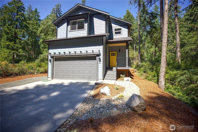 view of front of home with an attached garage and concrete driveway