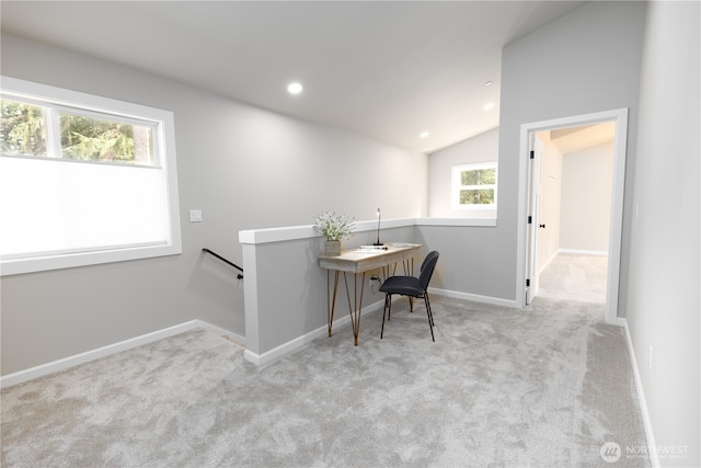 office area featuring recessed lighting, light colored carpet, vaulted ceiling, and baseboards