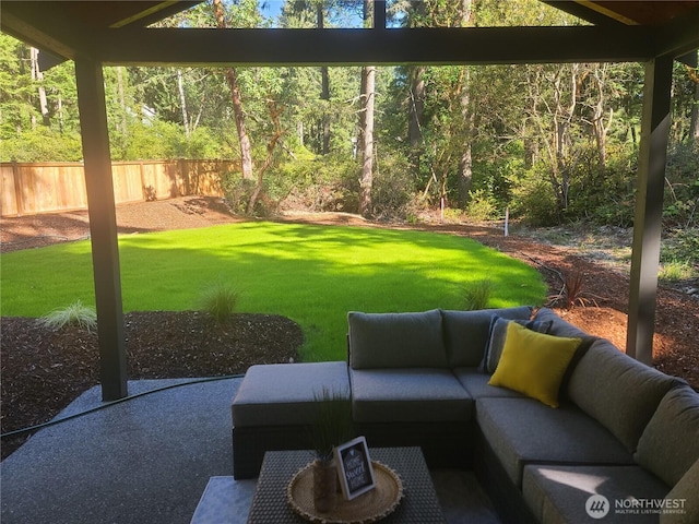 view of yard featuring outdoor lounge area and fence