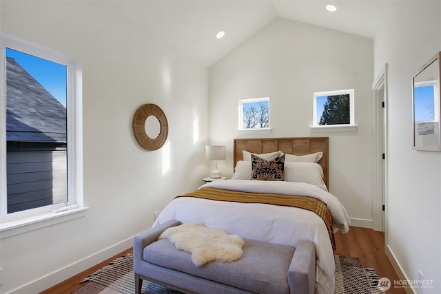 bedroom featuring vaulted ceiling, recessed lighting, wood finished floors, and baseboards