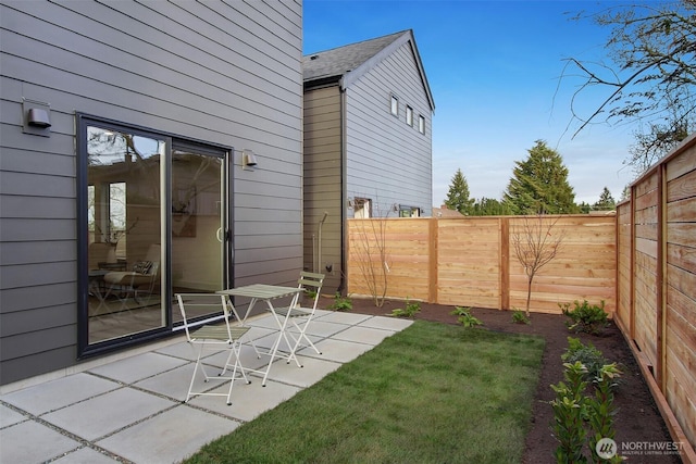 view of yard featuring a patio area and a fenced backyard