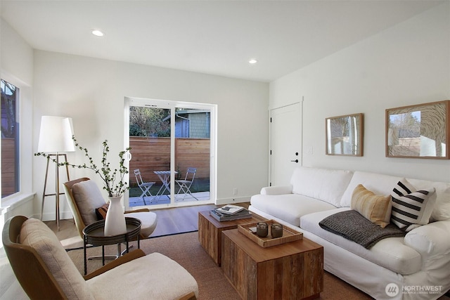 living area featuring recessed lighting, baseboards, and wood finished floors