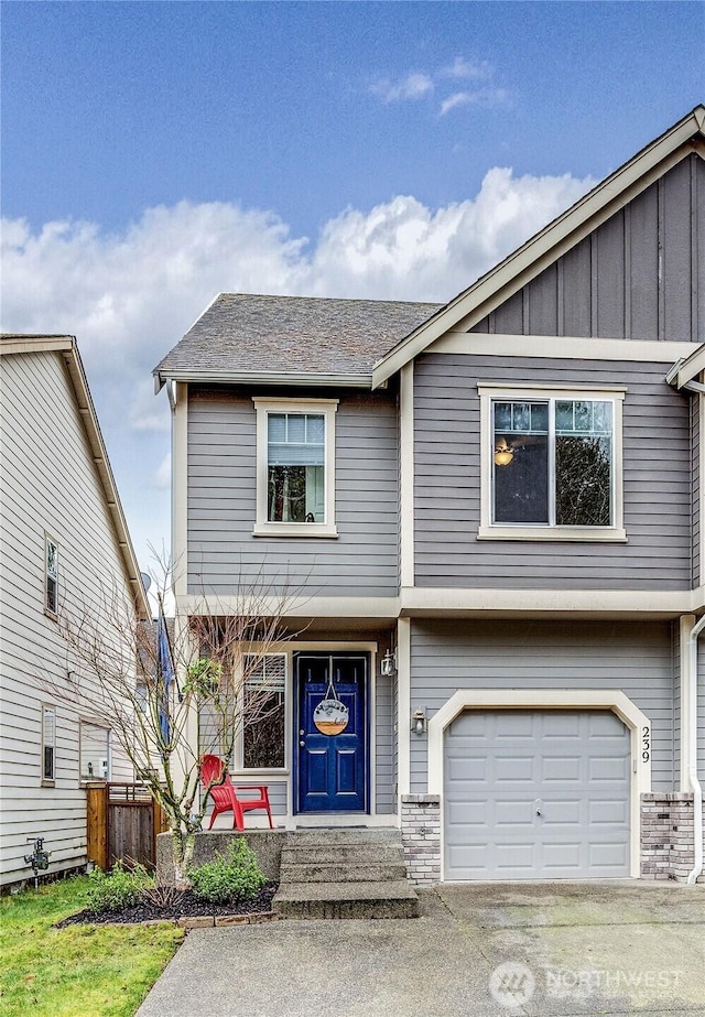 view of front of property with driveway, a porch, board and batten siding, and an attached garage