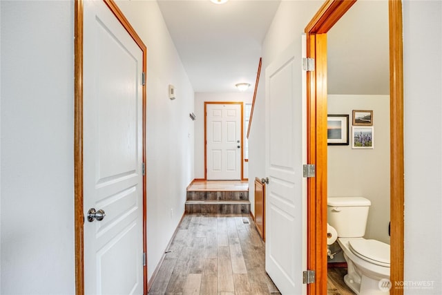 bathroom featuring toilet and wood finished floors