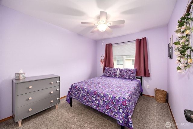 carpeted bedroom featuring a ceiling fan and baseboards