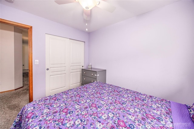 bedroom with carpet floors, a closet, and a ceiling fan