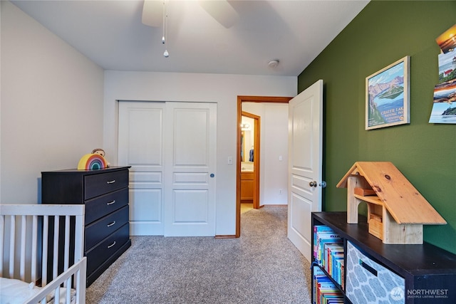 bedroom featuring ceiling fan, carpet floors, and a closet