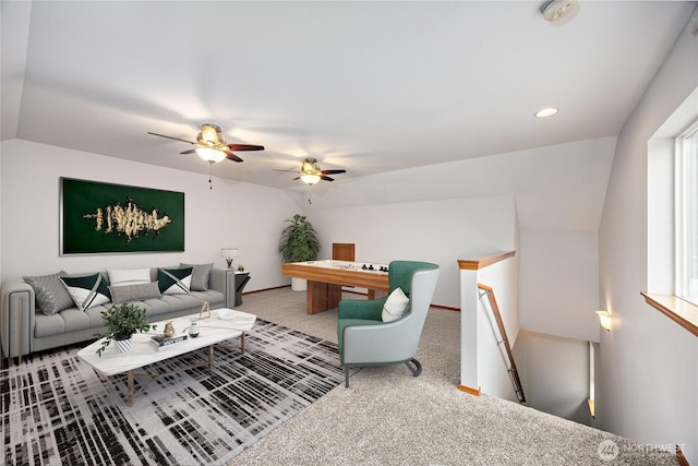 living room featuring lofted ceiling, baseboards, carpet flooring, and recessed lighting