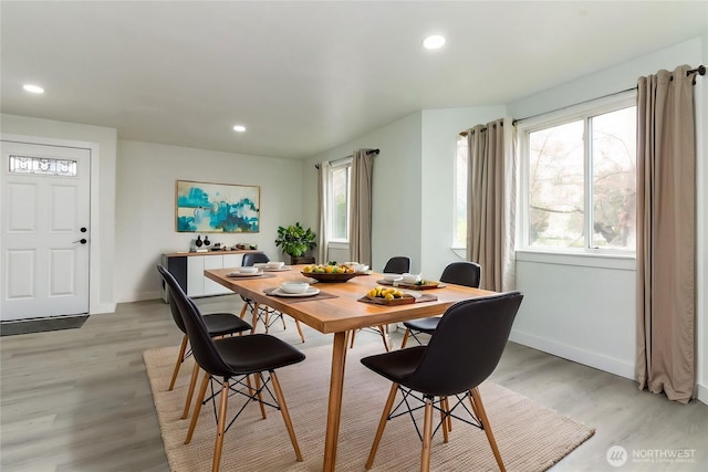 dining area featuring recessed lighting, a healthy amount of sunlight, and light wood-style floors