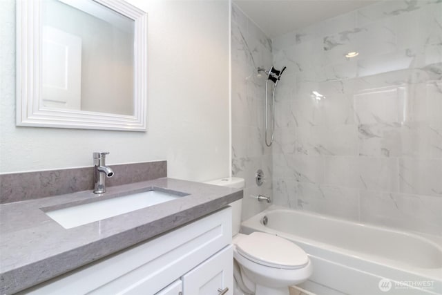 bathroom with toilet, shower / washtub combination, and vanity