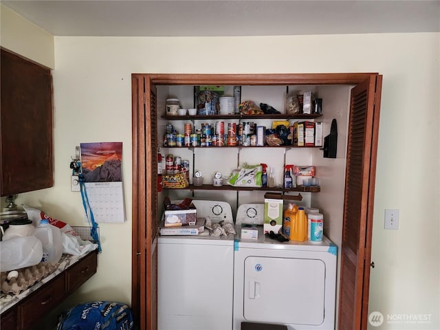 washroom featuring laundry area and separate washer and dryer