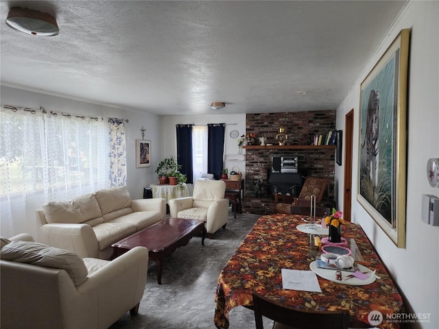 living area featuring a textured ceiling