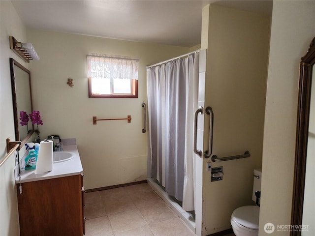 bathroom featuring toilet, vanity, a shower stall, and tile patterned floors