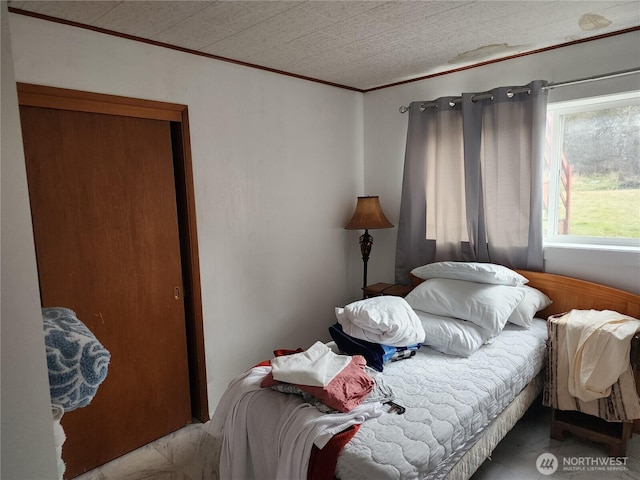 bedroom featuring crown molding