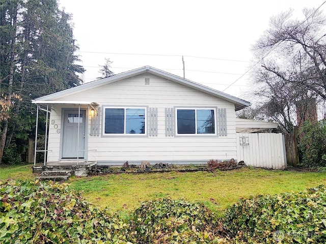 bungalow-style home featuring a front lawn