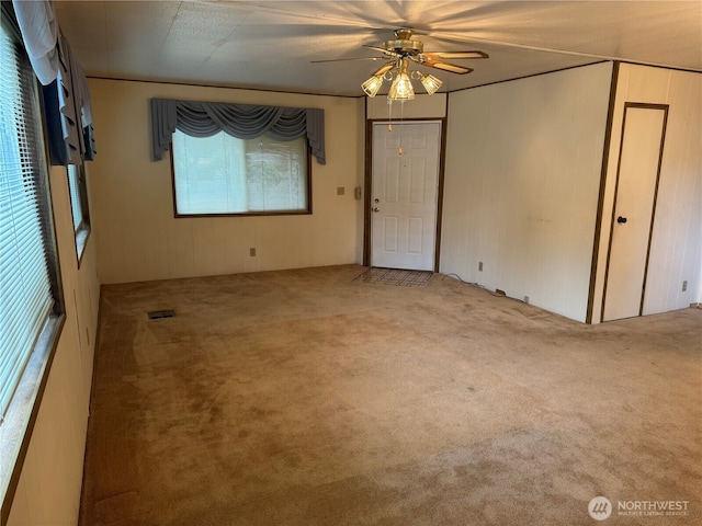 spare room with light carpet and visible vents