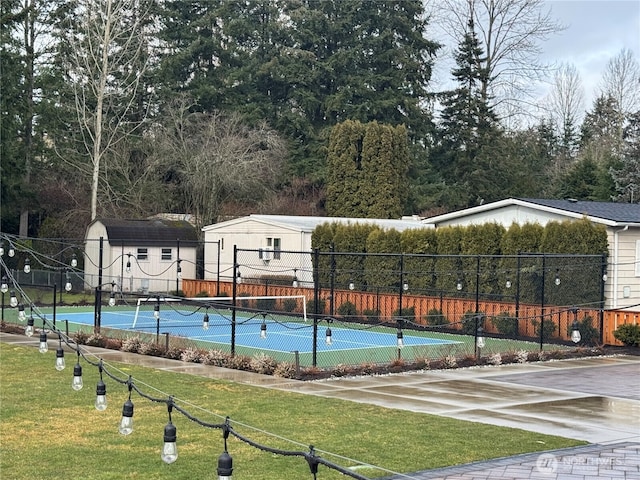 view of tennis court with fence