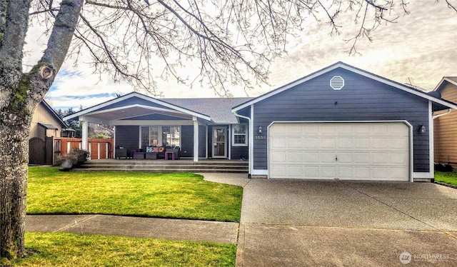 single story home featuring an attached garage, fence, concrete driveway, and a front yard