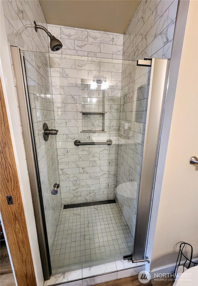 full bathroom with a shower stall